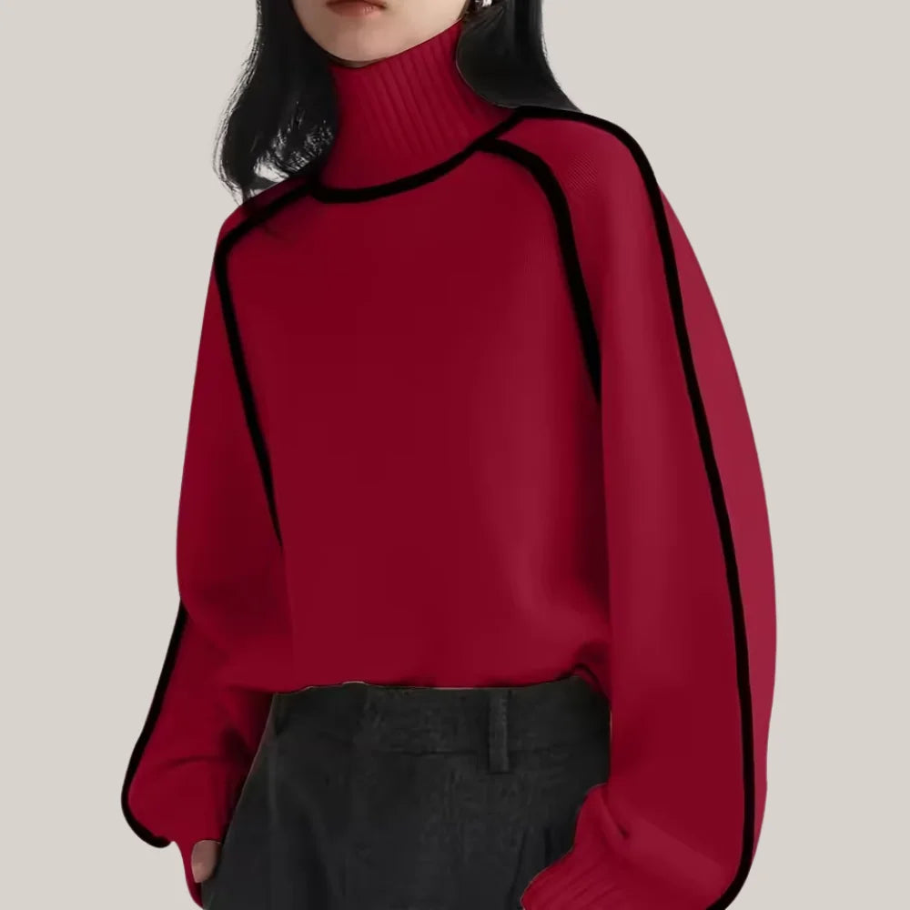 Women’s turtleneck knit sweater featuring contrast trim, made from soft fabric, with a cozy fit suitable for cooler weather.