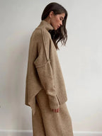 Women's relaxed fit turtleneck loungewear set made of soft, breathable fabric for comfort during lounging or casual wear.