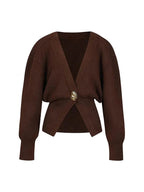 Women's V-neck cardigan featuring a unique button trim, made from soft, comfortable fabric for everyday wear.