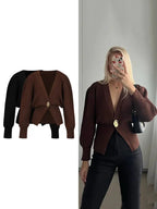 Women's V-neck cardigan featuring a soft fabric and unique button trim for a stylish, casual look. Perfect for layering.