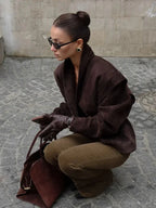Women's V neck long sleeve jacket featuring a single button closure, crafted from soft, breathable fabric for comfort.