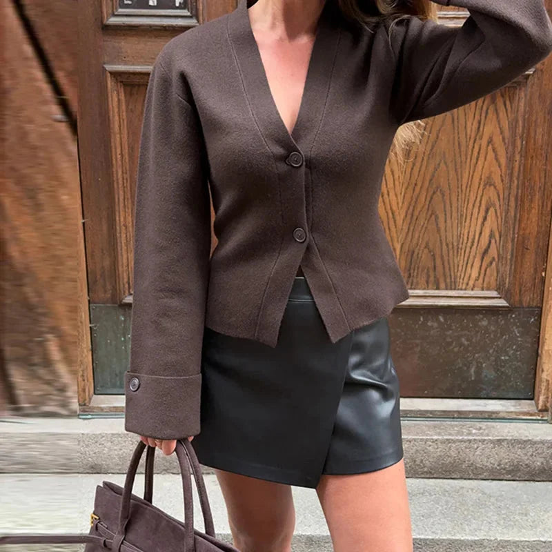 Alt text: Women's V-neck loose cardigan with button details, featuring soft knit fabric and a relaxed fit for comfortable…