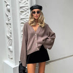 Lightweight women's V-neck cardigan with button details, made from soft knit fabric for comfort and a relaxed fit.