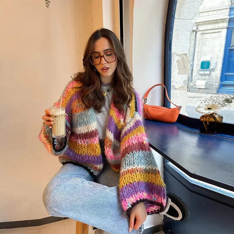 Vibrant striped women's cardigan with wide sleeves, made from soft cotton fabric for comfortable everyday wear.