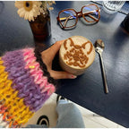 Women's striped cardigan in soft fabric, featuring wide sleeves and a colorful pattern for a comfortable, relaxed fit.
