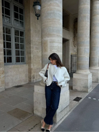 Women's white short coat made of soft fabric featuring oversized sleeves and a tailored fit for a modern look.