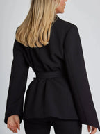 Women's wrap blazer with tie waist, long sleeves, crafted from soft fabric with a tailored silhouette for versatile styling.