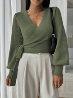 Women's wrap knit cardigan in soft fabric, featuring a tie waist and long sleeves for a cozy, stylish fit.