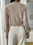 Women's wrap knit cardigan with tie waist, crafted from soft, breathable yarn with a cozy, open-front design.