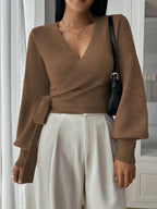 Women's wrap knit cardigan with tie waist, made of soft, breathable fabric featuring a relaxed fit and open front design.