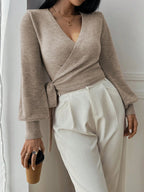 "Women's wrap knit cardigan with tie waist, featuring soft fabric and a stylish open front design for versatile layering."