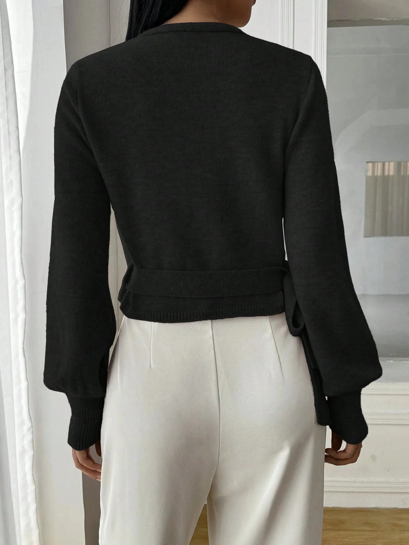 Women's wrap knit cardigan with tie waist, featuring soft fabric, open front design, and adjustable waist for a customizable…