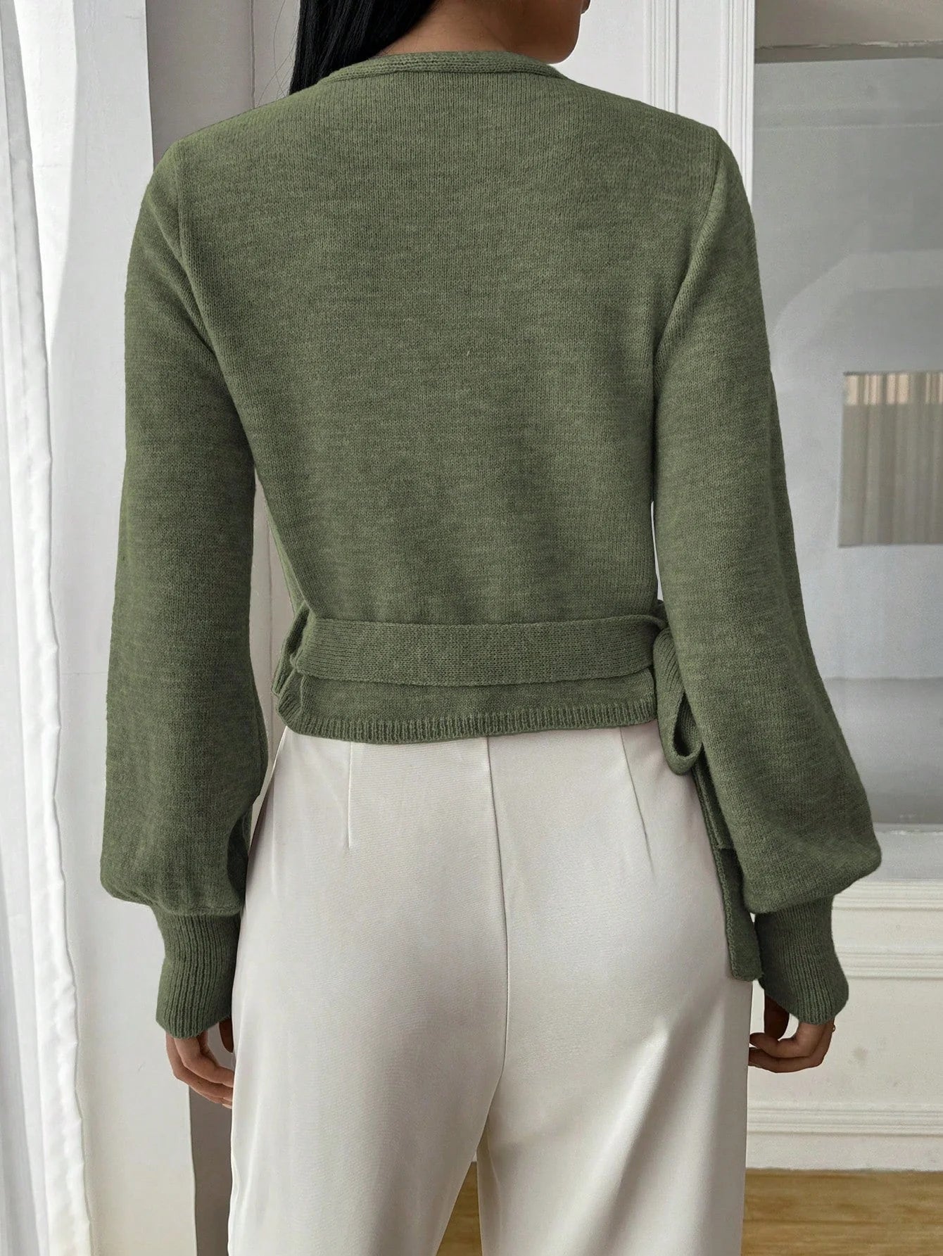 Lightweight women's wrap knit cardigan with tie waist, featuring soft fabric and versatile design for layering in any season.