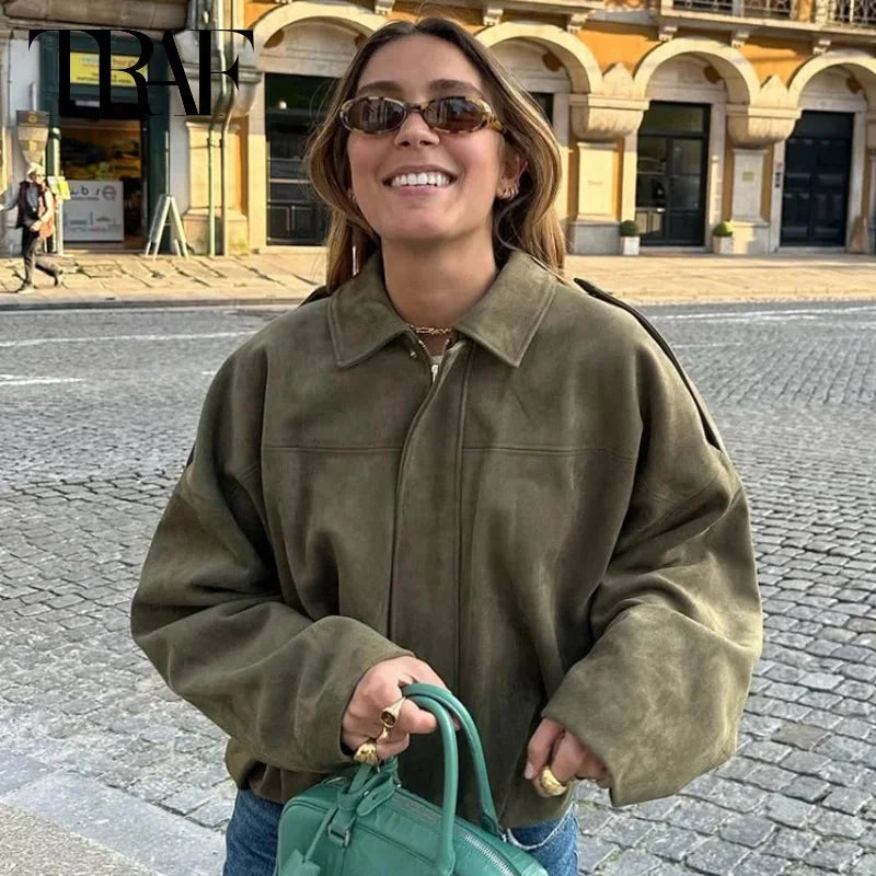 Women's zip-up bomber jacket with long sleeves, lapel collar, made from lightweight fabric with practical side pockets.