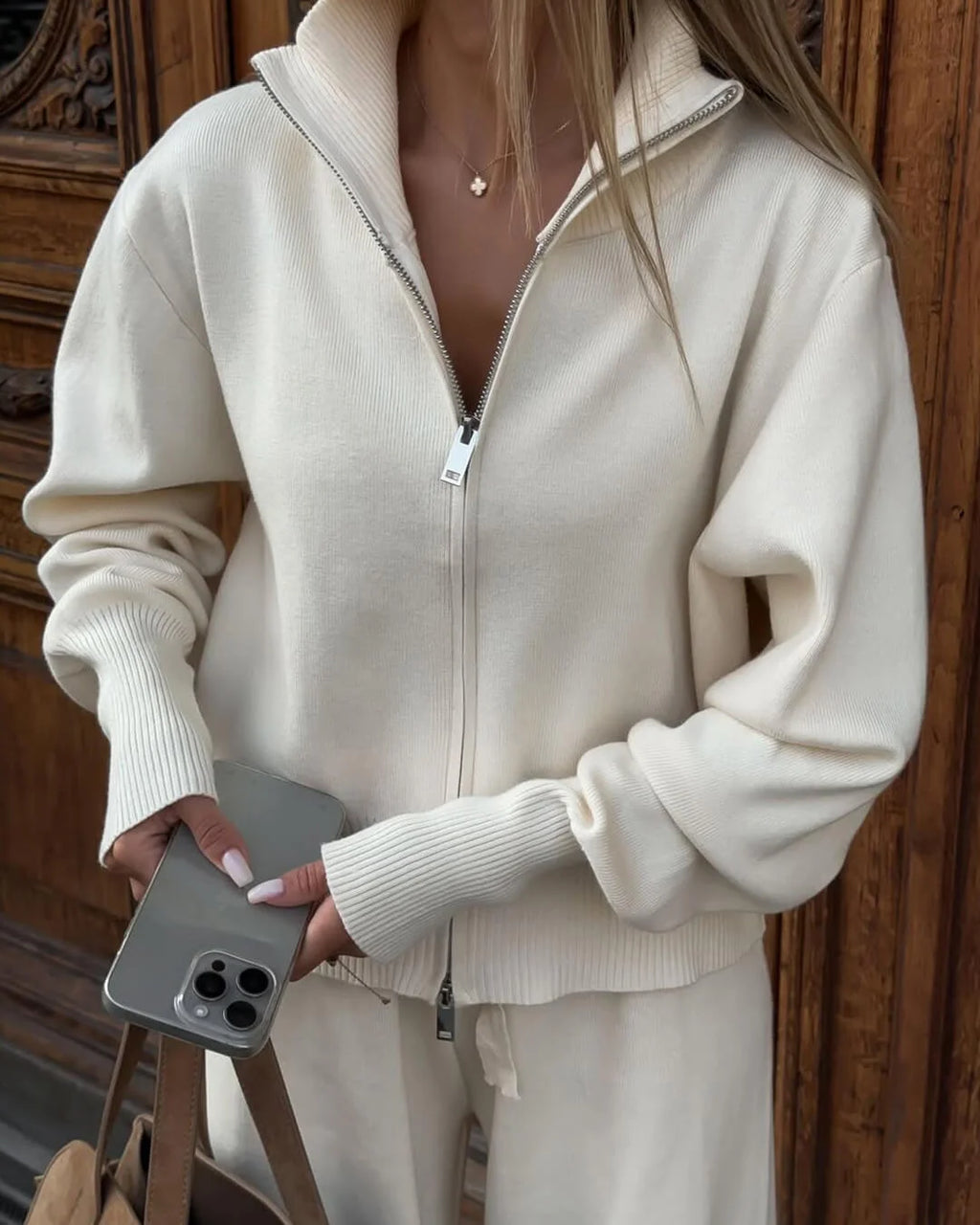 Women's knitted cotton loungewear set with a zipper front, featuring comfortable fit and soft fabric perfect for relaxing.