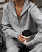 Women's knitted cotton loungewear set with zipper front, featuring a relaxed fit and soft, breathable material for comfort.